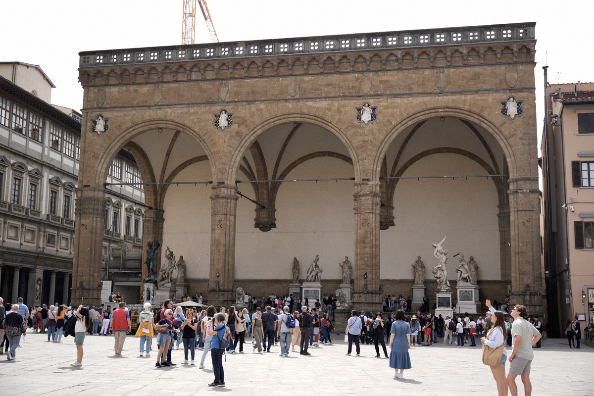 The Loggia dei Lanzi on Piazza della Signoria with its three arches and the sculptures beneath.